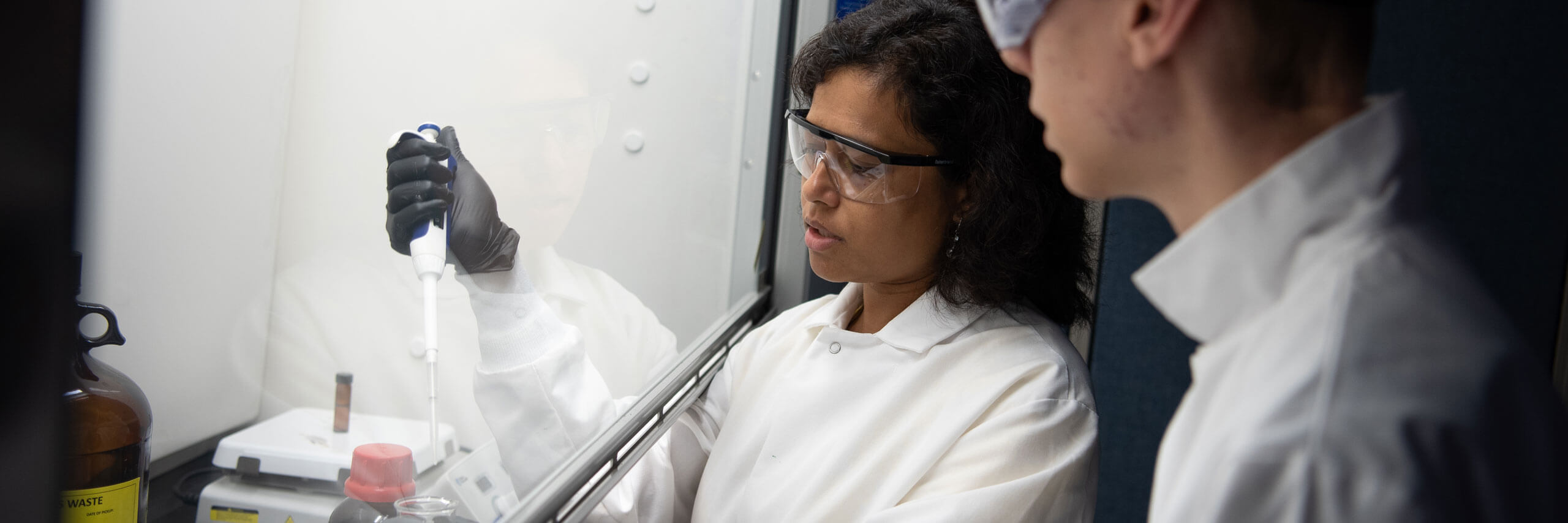 Dr. Mahua Biswas works with student researcher in her lab.